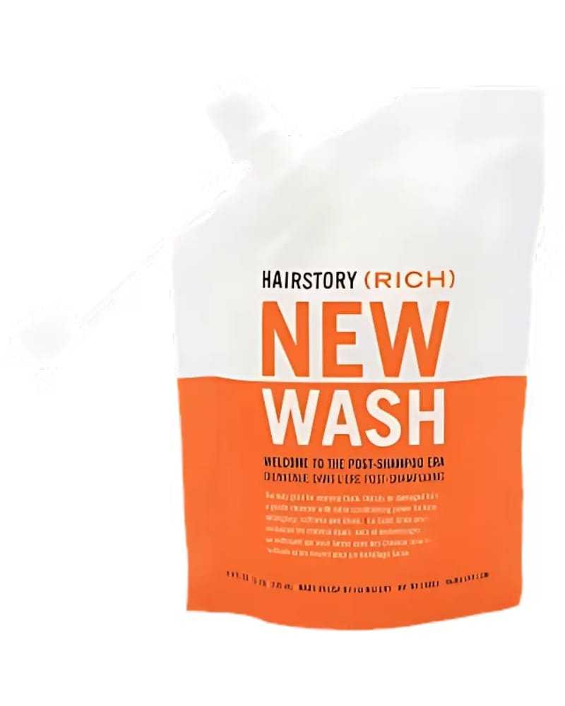 Pouch of Hairstory New Wash (Rich) with orange and white design.